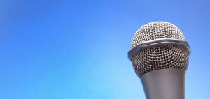 Microphone over blue background.