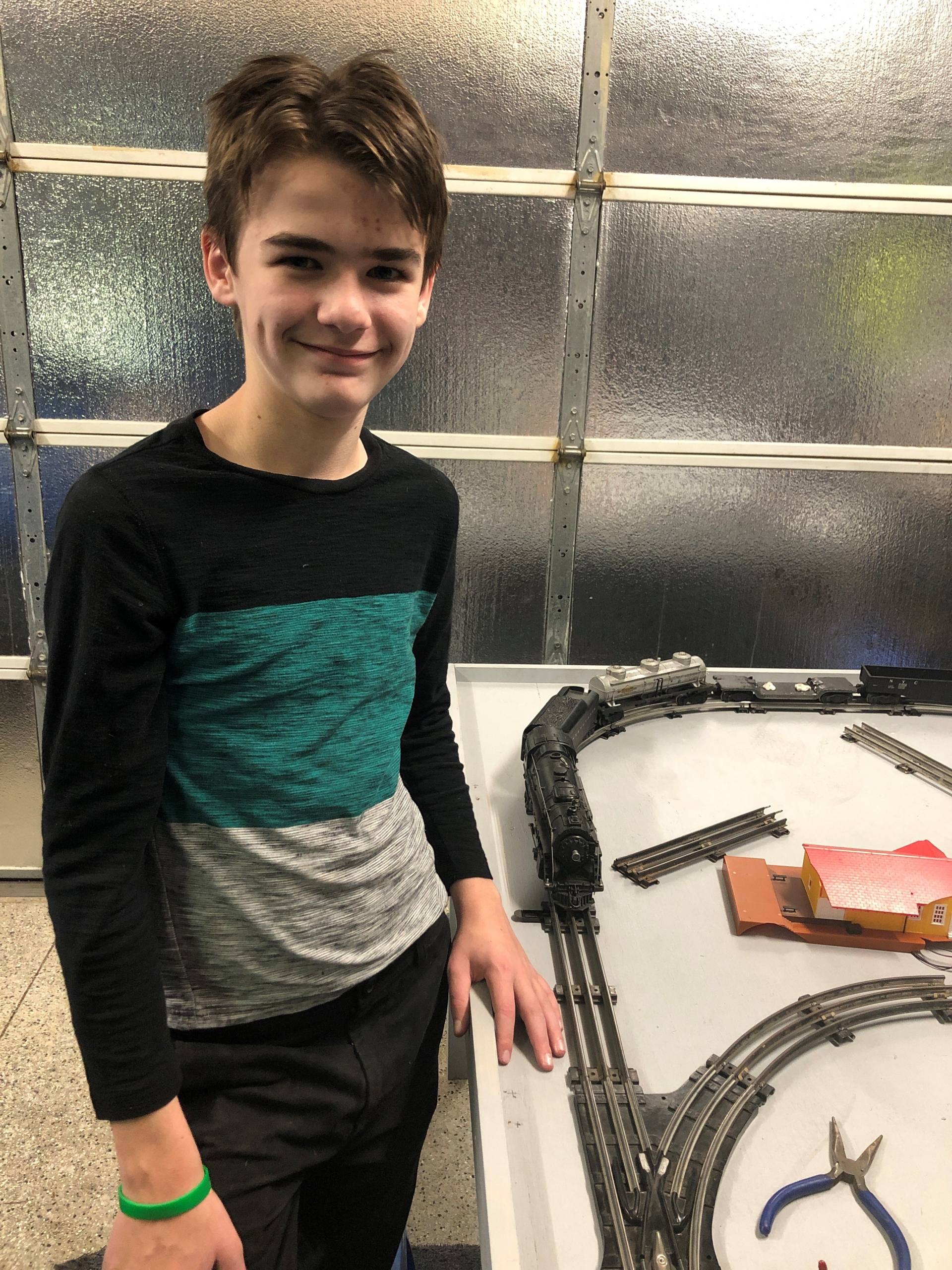 Jadon S. with a train set.