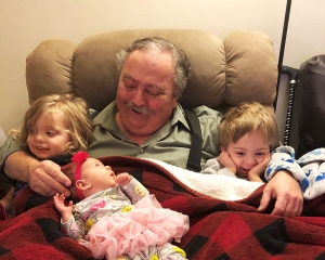 Jim with his three grandchildren.