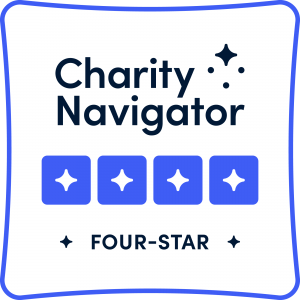 Charity Navigator Four-Star Organization badge in black, white, and purple.
