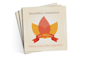 Three stacked HealthWell Foundation 20th Anniversary books.