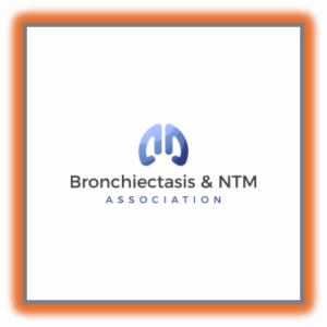 Logo of the Bronchiectasis & NTM Association featuring a stylized blue graphic resembling lungs above the association’s name in black and blue text on a white background.